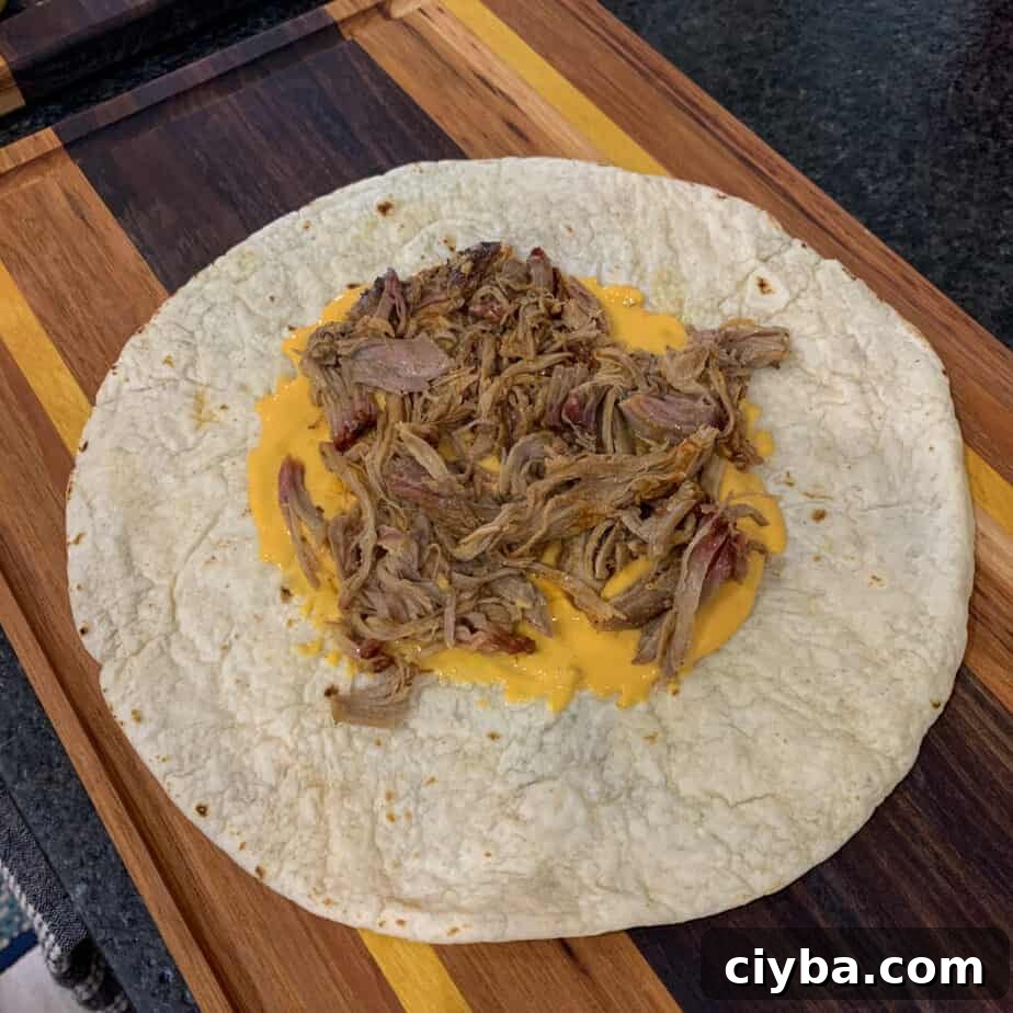 Crispy Pulled Pork Crunchwrap Supreme Recipe 5 tortilla, queso, and pulled pork for pulled pork crunch wrap