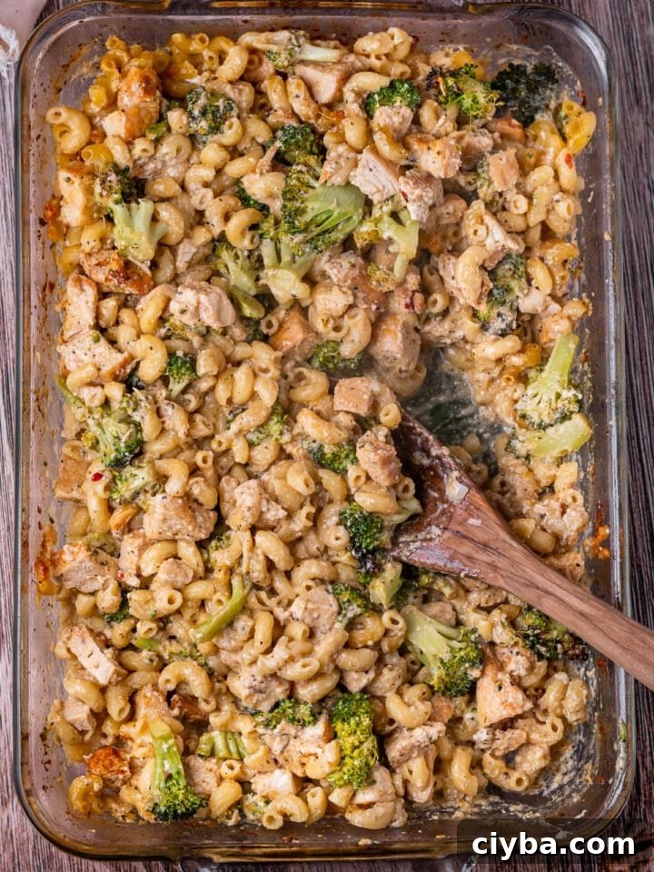 casserole dish with featured recipe and a wooden spoon in it