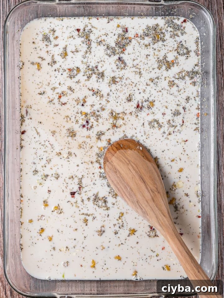 milk and broth added to the casserole dish
