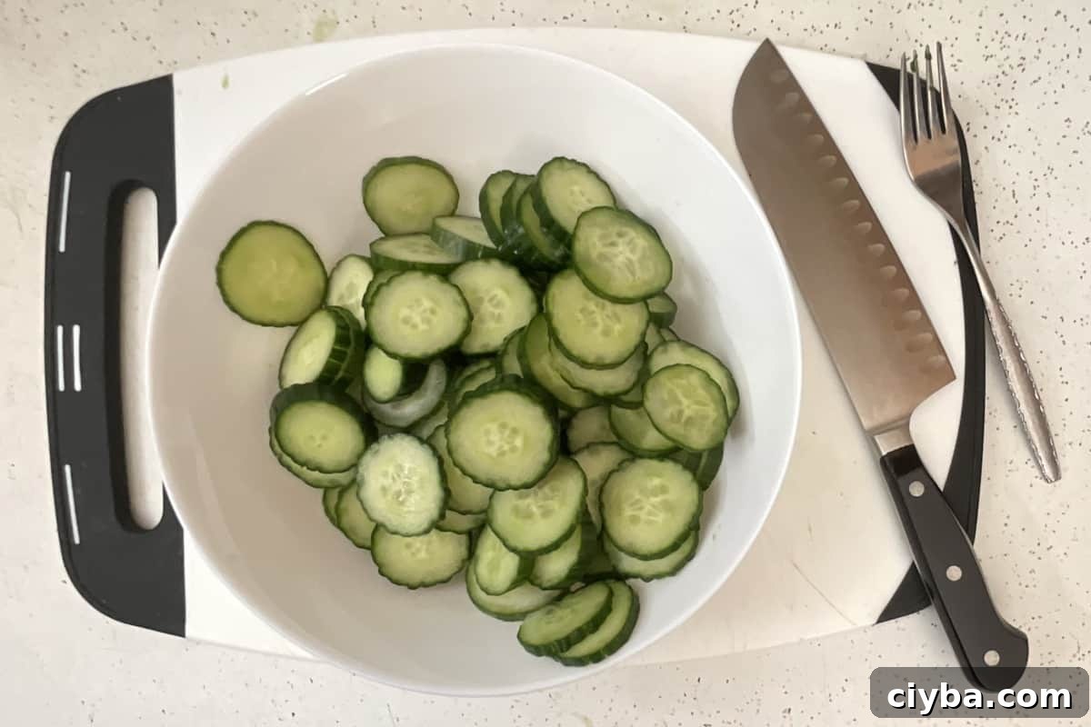cucumbers cut up in a bowl waiting to be salted.