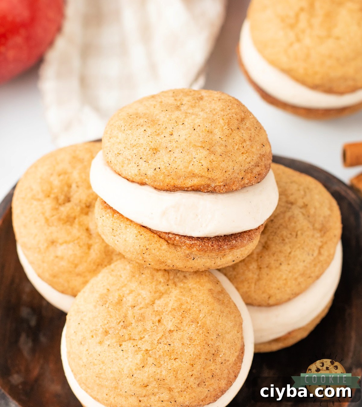 Apple Cider Snickerdoodle Cream Pie Recipe 2 Close-up of Apple Cider Snickerdoodle Cream Pies with spiced cookies and creamy apple cider frosting filling.