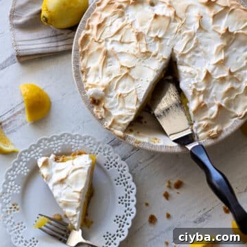 Piece of lemon meringue pie being served.
