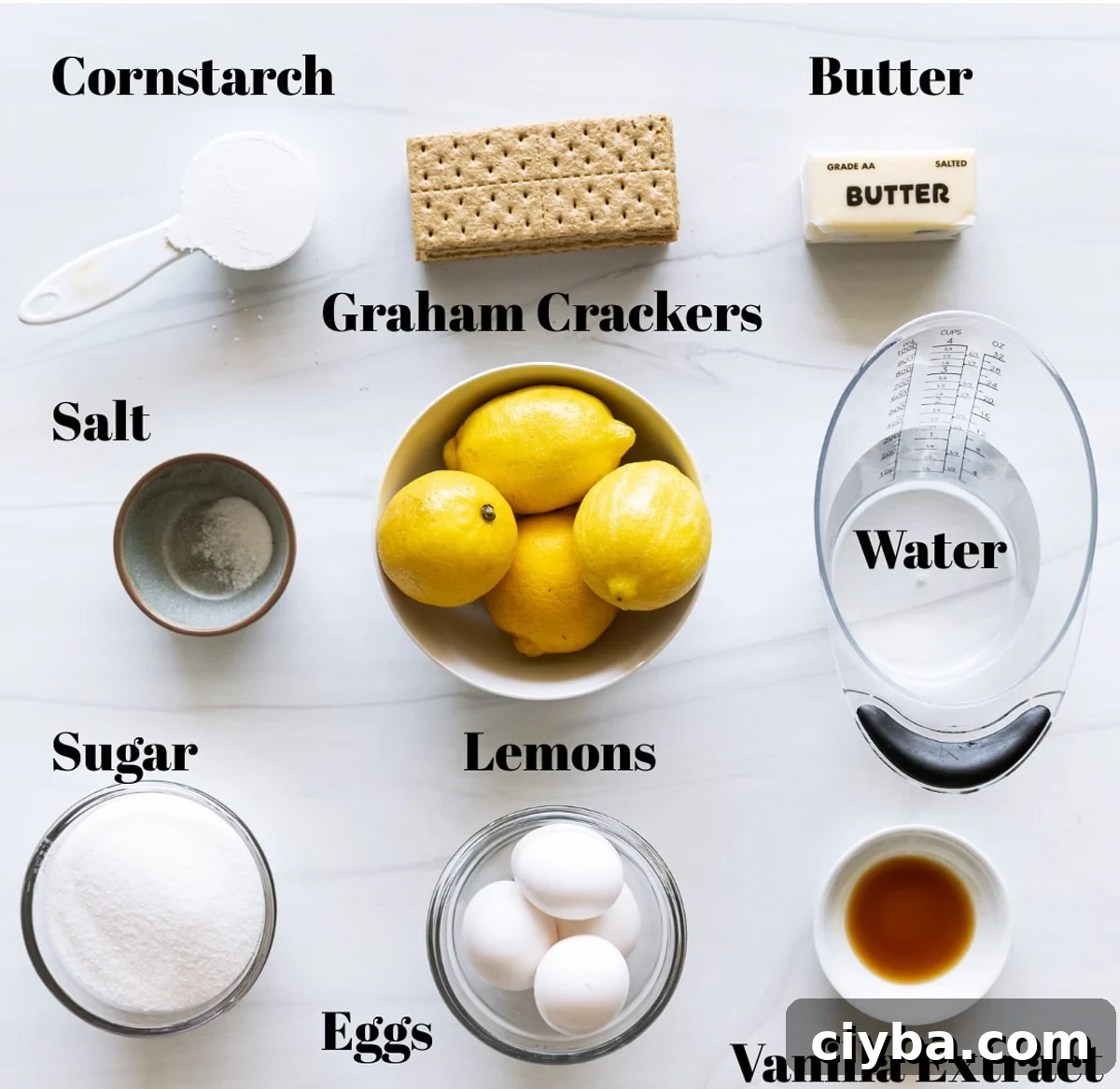 Ingredients to make homemade lemon meringue pie on a counter.