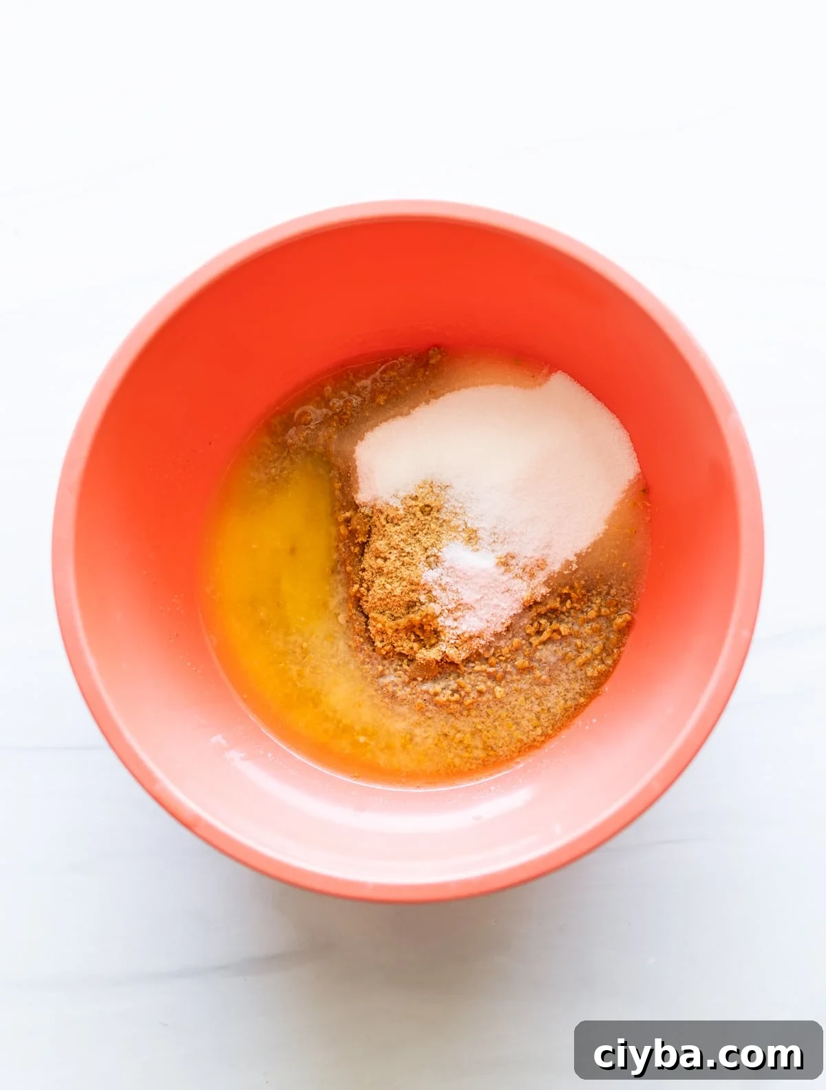 Graham cracker crust ingredients in a bowl.