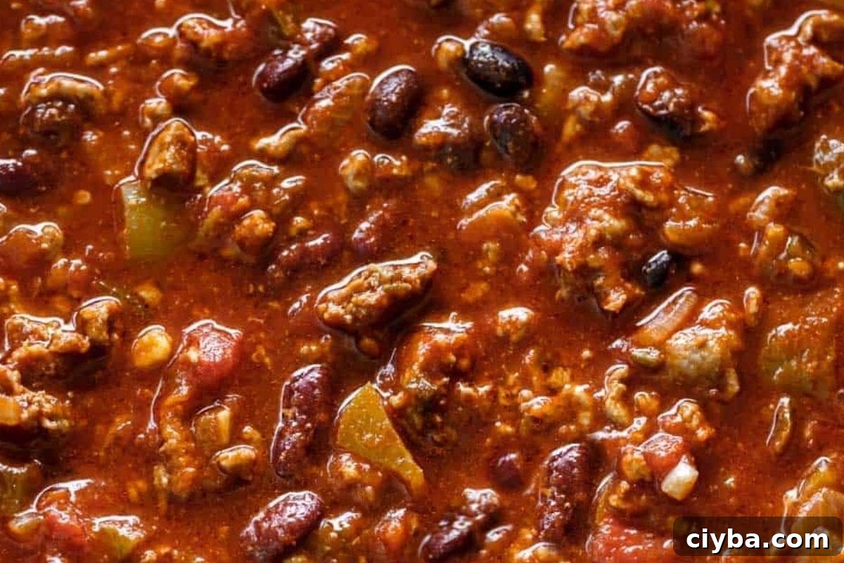 Add the kidney and black beans to the slow cooker.