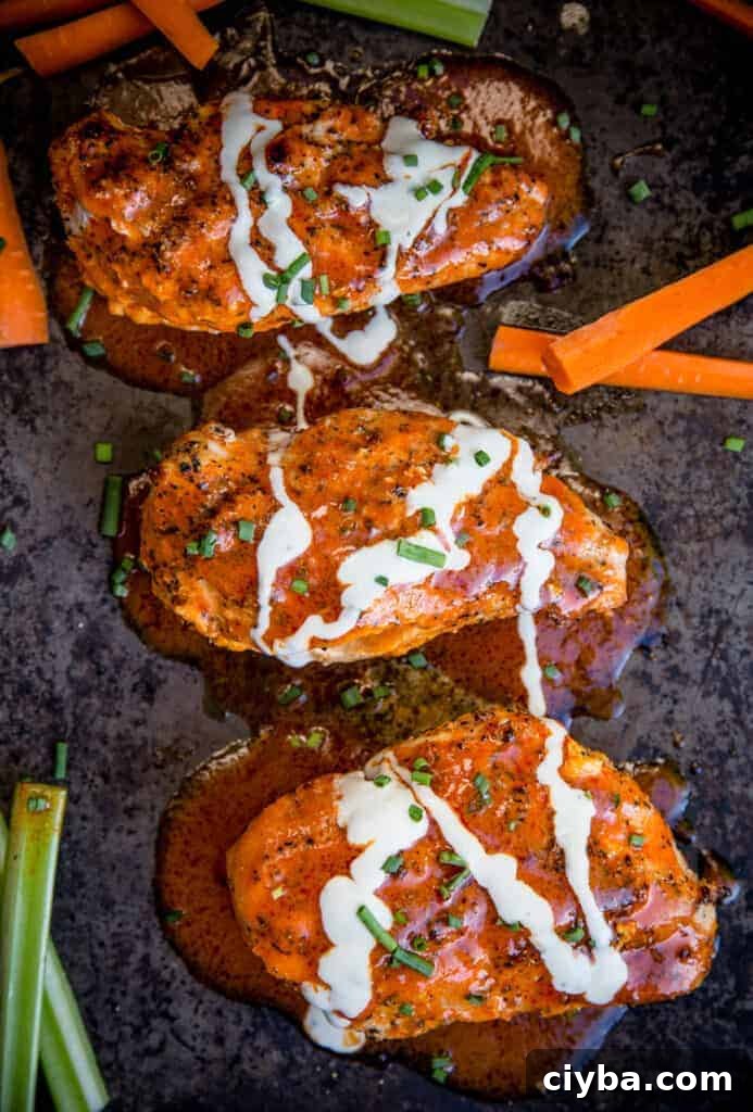Buffalo Stuffed Grilled Chicken Breasts on a sheet pan