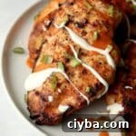 grilled buffalo chicken breasts drizzled with ranch dressing