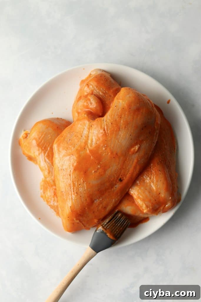 chicken breasts brushed with buffalo sauce