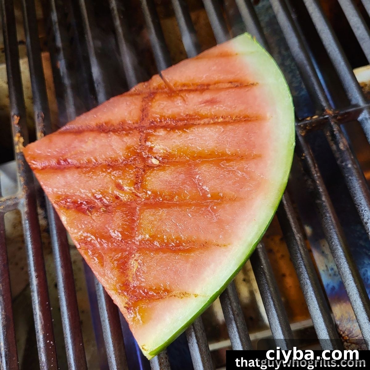 Watermelon with grill marks on a gas grill