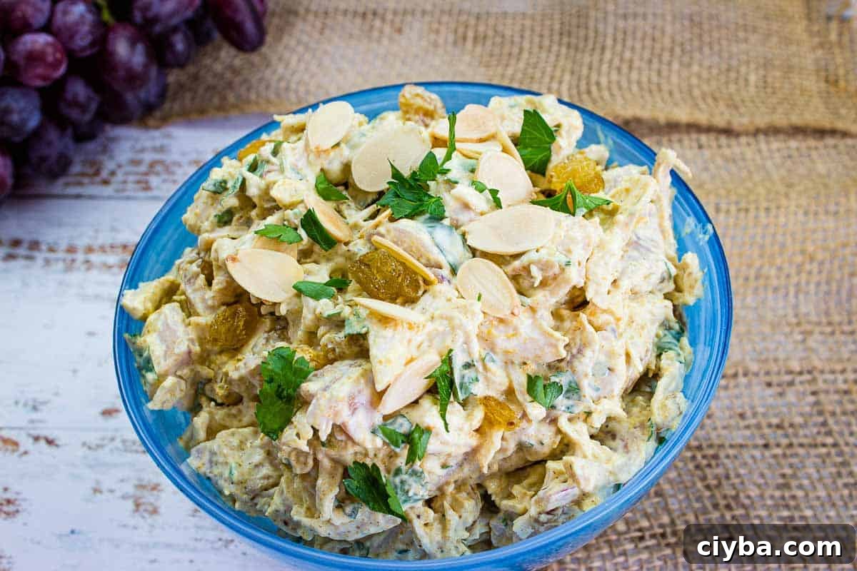 Curried chicken salad in a blue bowl.