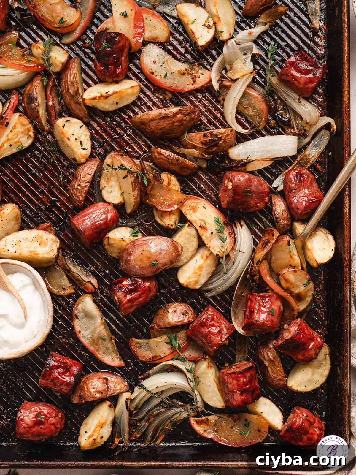 Overhead view of sheet pan potato, apple, and sausage