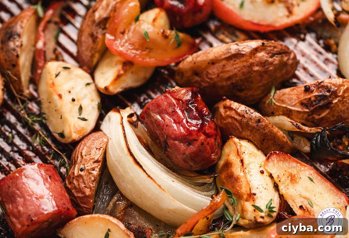Overhead view of sheet pan potato, apple, and sausage