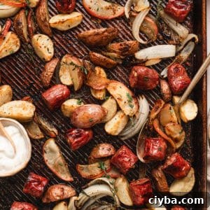 Overhead view of sheet pan potato, apple, and sausage