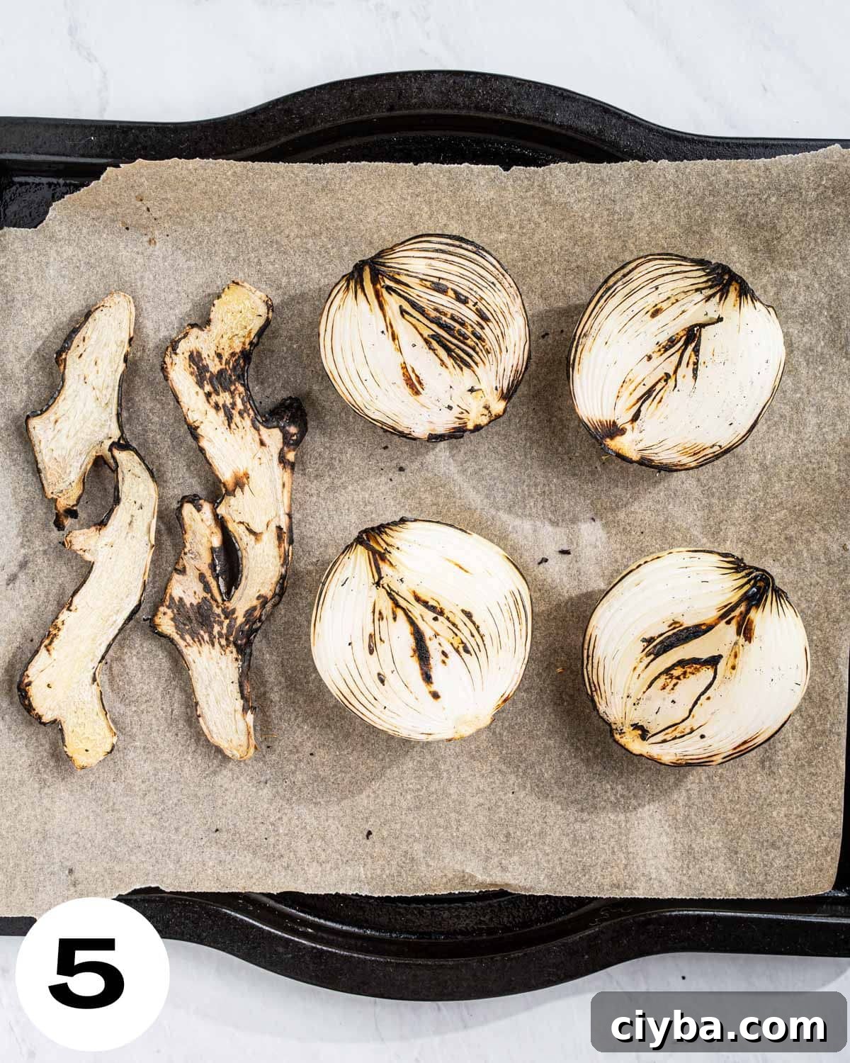 Tray with charred onions and ginger.