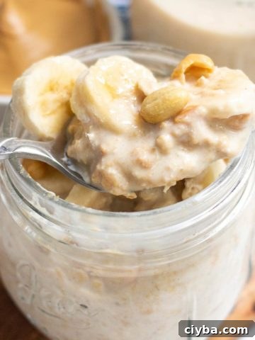 Peanut Butter Overnight Oats in a mason jar with banana slices on top.