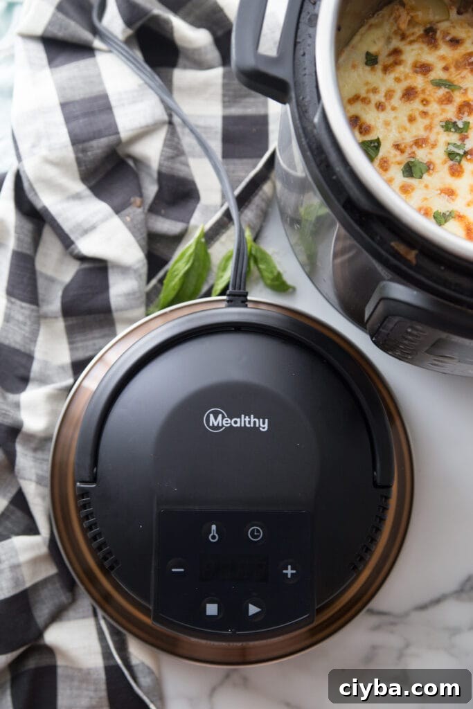 Overhead shot of Mealthy CrispLid on countertop with Instant Pot Zucchini Lasagna in the corner