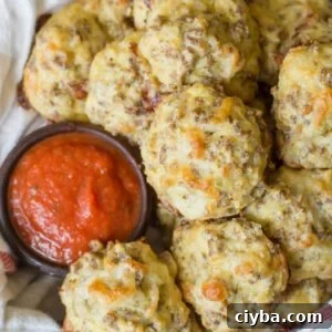 These Easy Keto Pizza Bites are loaded with Italian sausage and mozzarella! Perfect for keto meal prep and under 1 net carb per bite!