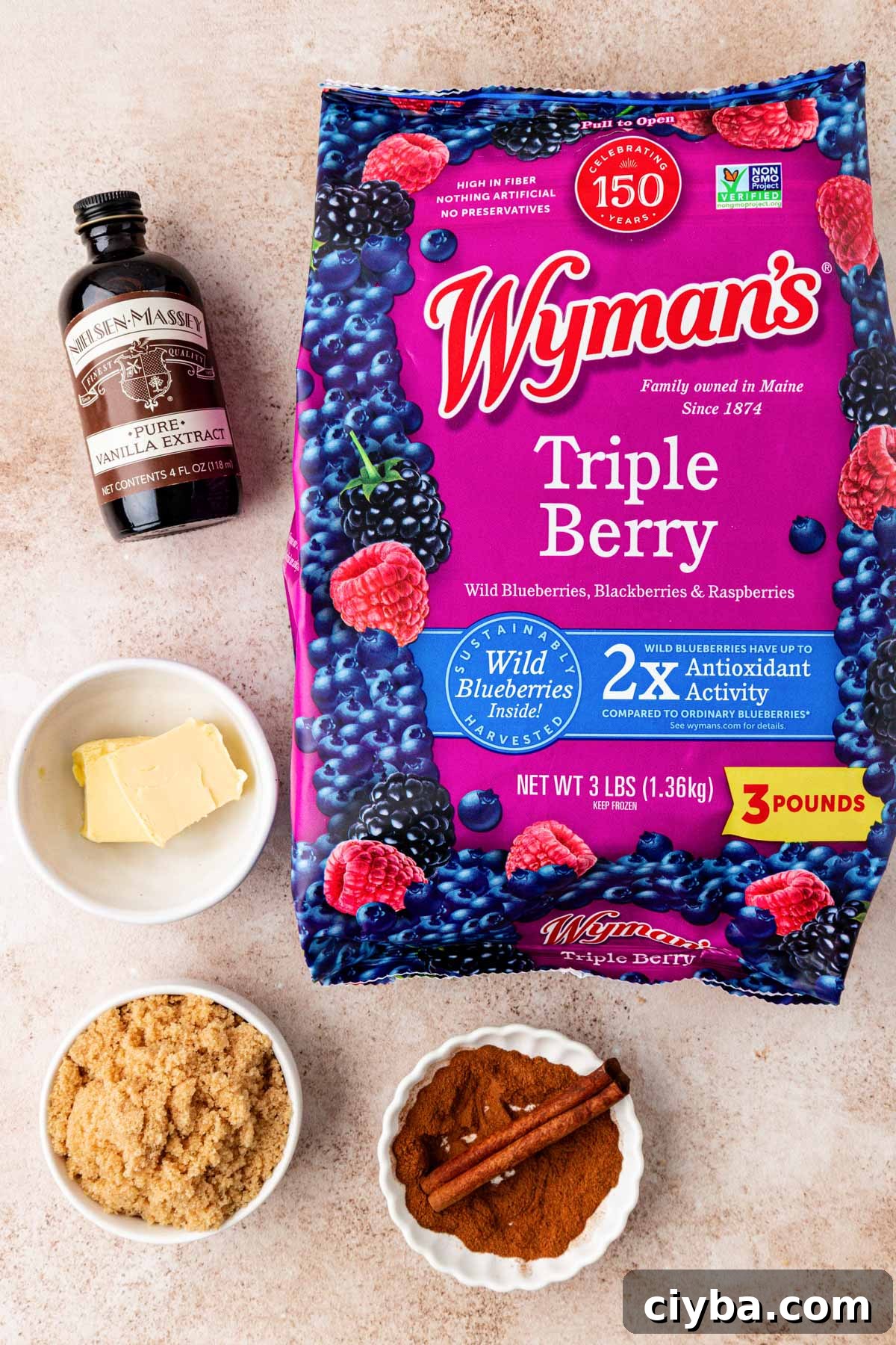 Overhead photo of ingredients to make mixed berry compote on a table.