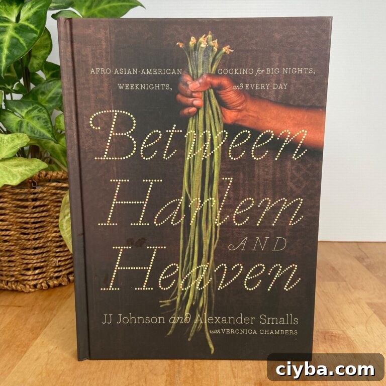 A cookbook titled Alexander Smalls - Between Harlem and Heaven: Afro-Asian-American Cooking for Big Nights, Weekends, and Every Day.