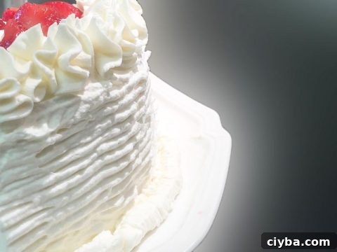 Gluten-Free White Cake Recipe: Moist, Fluffy, and Simple 3 Gluten Free White Cake Decorated with Icing Comb