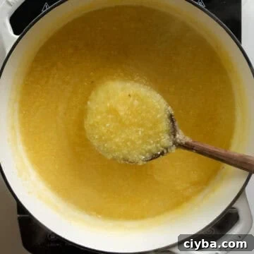 Thickening polenta in a pot.