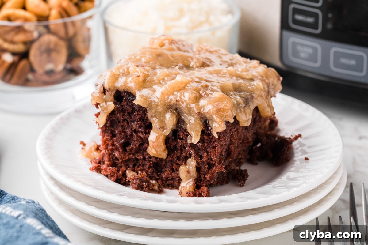 Slow Cooker German Chocolate Cake Recipe: Moist, Rich & Effortless 9 A slice of slow cooker German chocolate cake on a stack of three white plates.