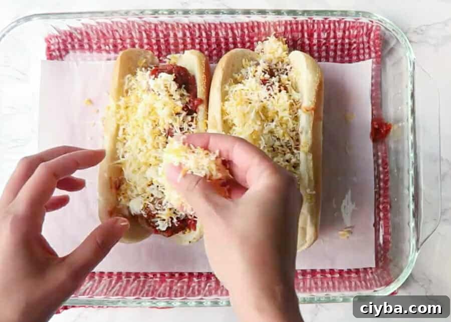 Quick Vegan Marinara Sauce Recipe – Ready in Minutes 7 adding cheese to a meatball sub made with the best baked meatballs