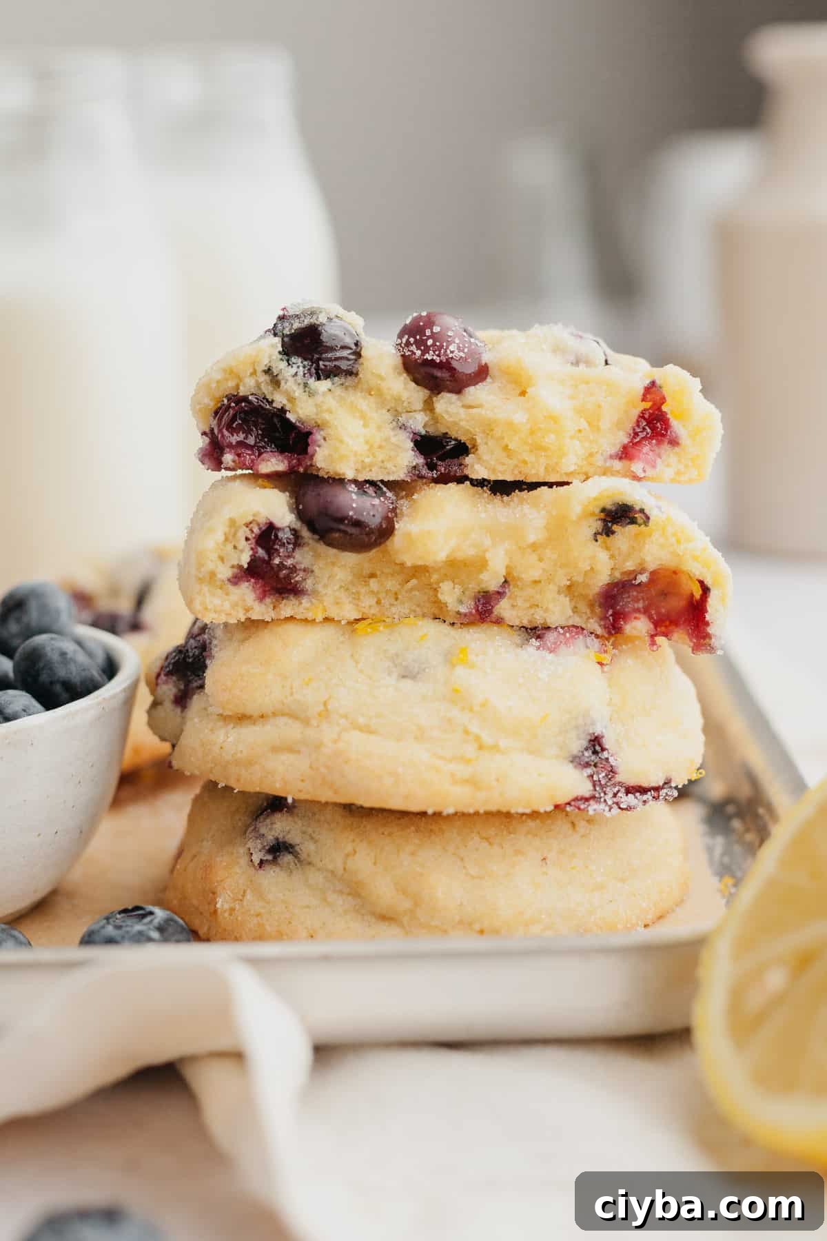 A stack of lemon blueberry cookies cut in half.