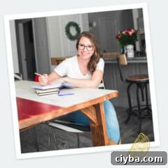 Author sitting at table smiling