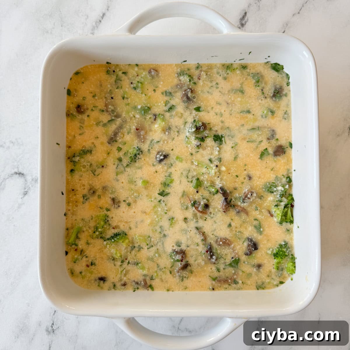 Gluten free breakfast casserole ready to bake in the oven.