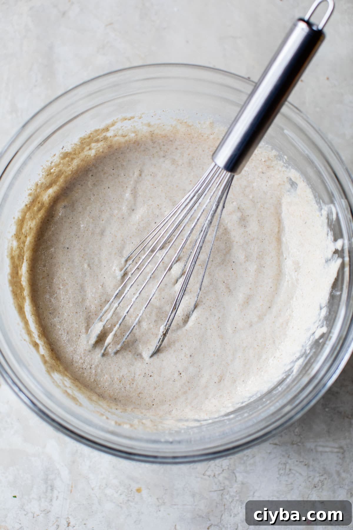 pancake batter in a glass mixing bowl