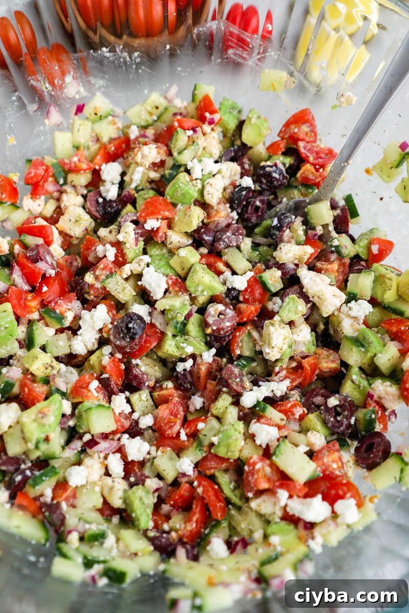 Mediterranean Avocado and Feta Salsa Recipe 5 A large bowl filled with freshly made Mediterranean salsa topped with crumbled feta