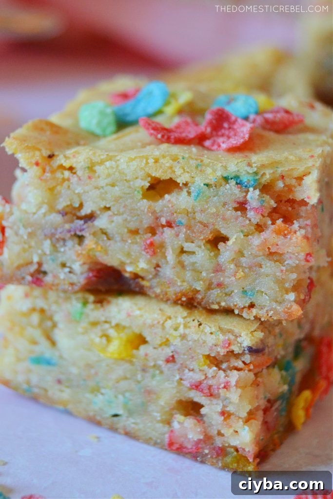 Fruity Pebbles Blondies Recipe: Chewy, Colorful Treats 6 Closeup stack of fruity pebbles blondies