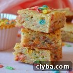 Fruity Pebbles Blondies Recipe: Chewy, Colorful Treats 7 a trio stack of fruity pebble blondies