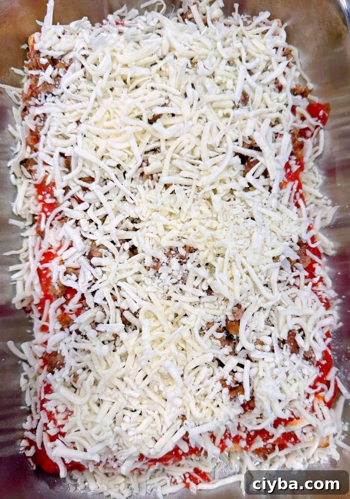 Deep-Dish Hot Pocket Pizza: Crispy Stuffed Pizza Pockets 9 More cheese added to pizza on top of sausage.