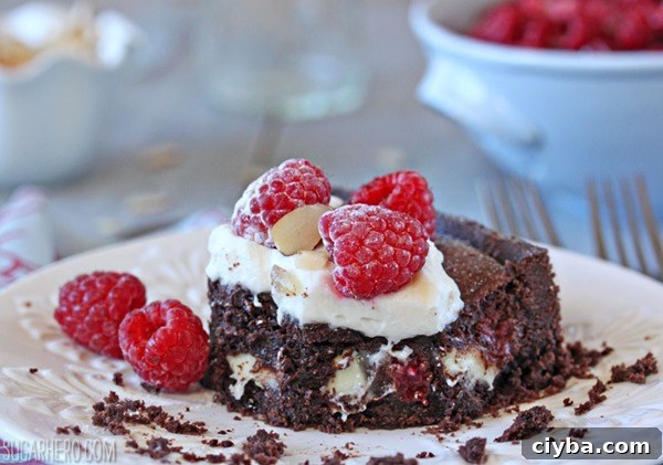 Chocolate Raspberry Almond Truffle Tart | From SugarHero.com