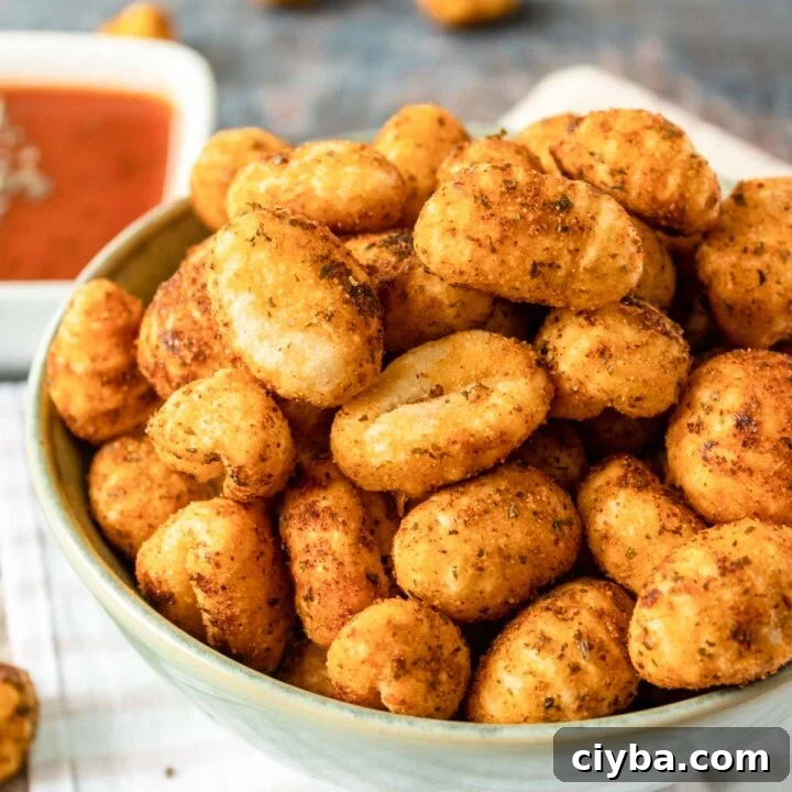 Crispy Air Fryer Gnocchi with Garlic Butter and Parmesan 8 bowl of seasoned air fryer gnocchi.