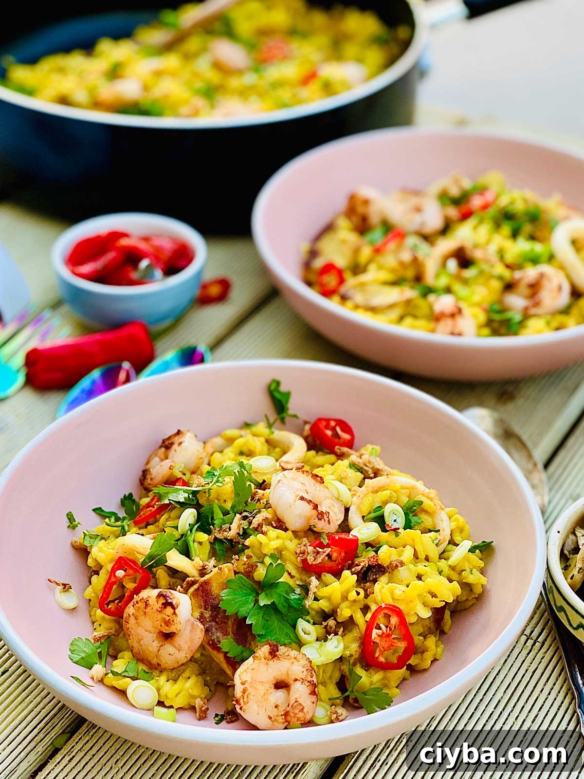 Pork and seafood risotto with turmeric and long pepper