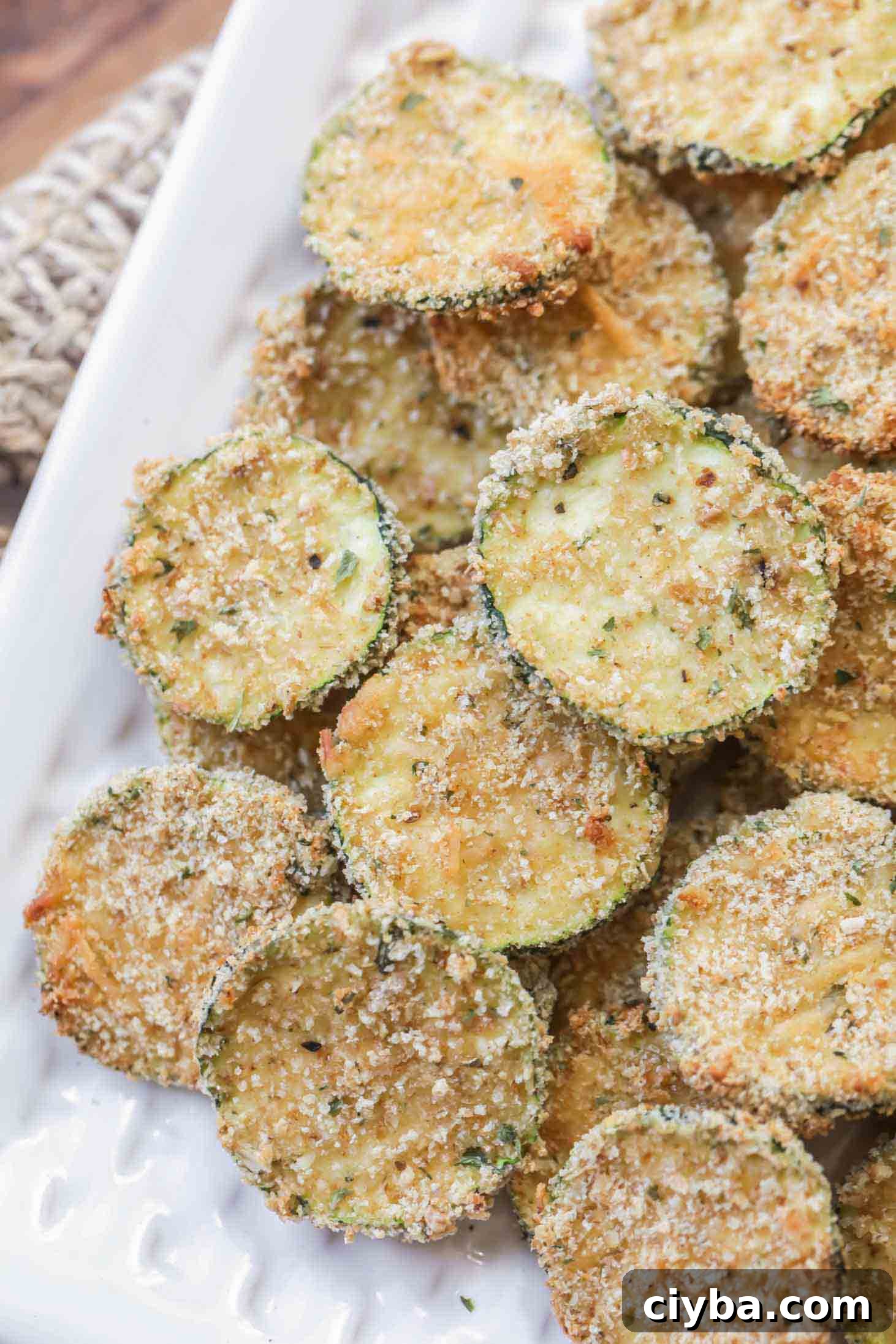 parmesan zucchini chips on a white plate