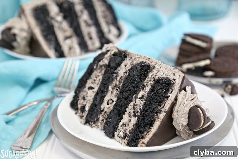Cookies and Cream Cake - two slices of cookies and cream cake on white plates