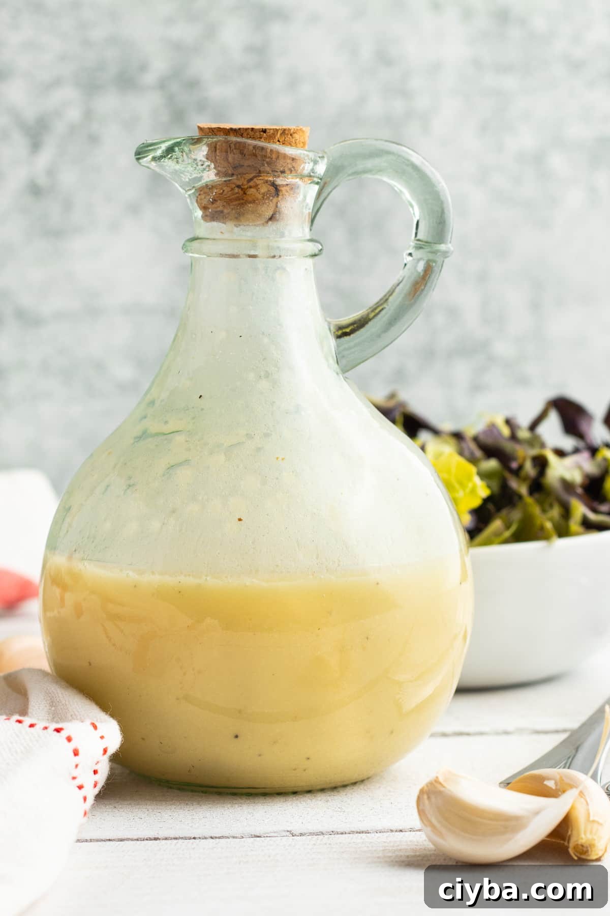 Picture of a jar filled with champagne vinaigrette.