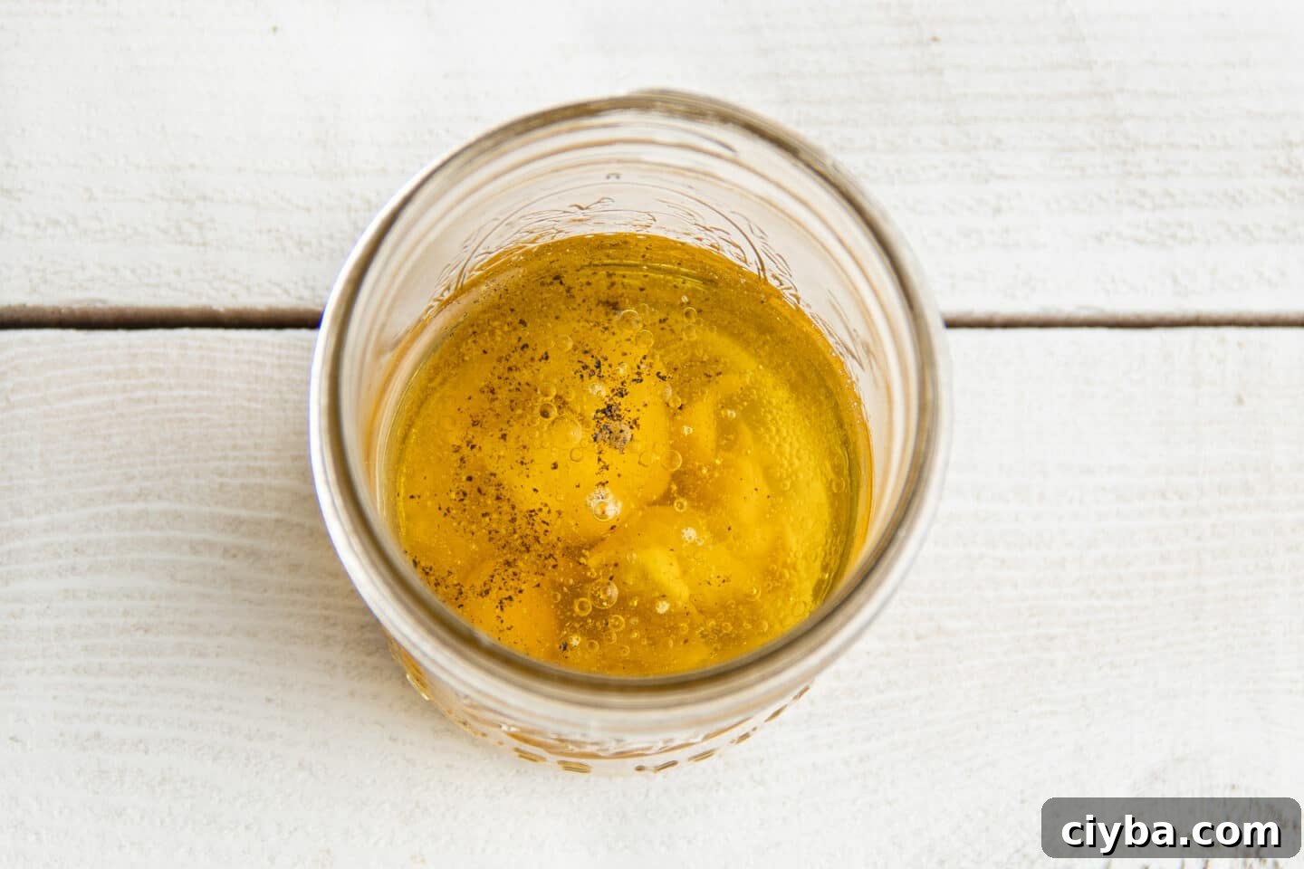Add all ingredients to a jar.