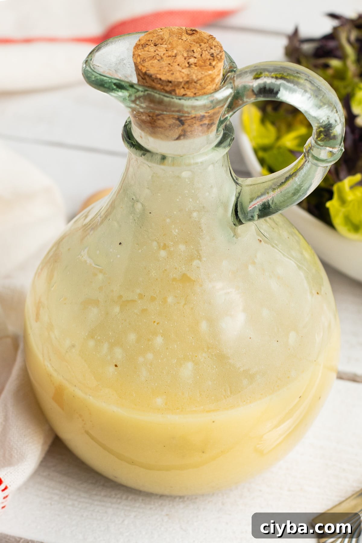 Close up picture of a jar of champagne vinaigrette.