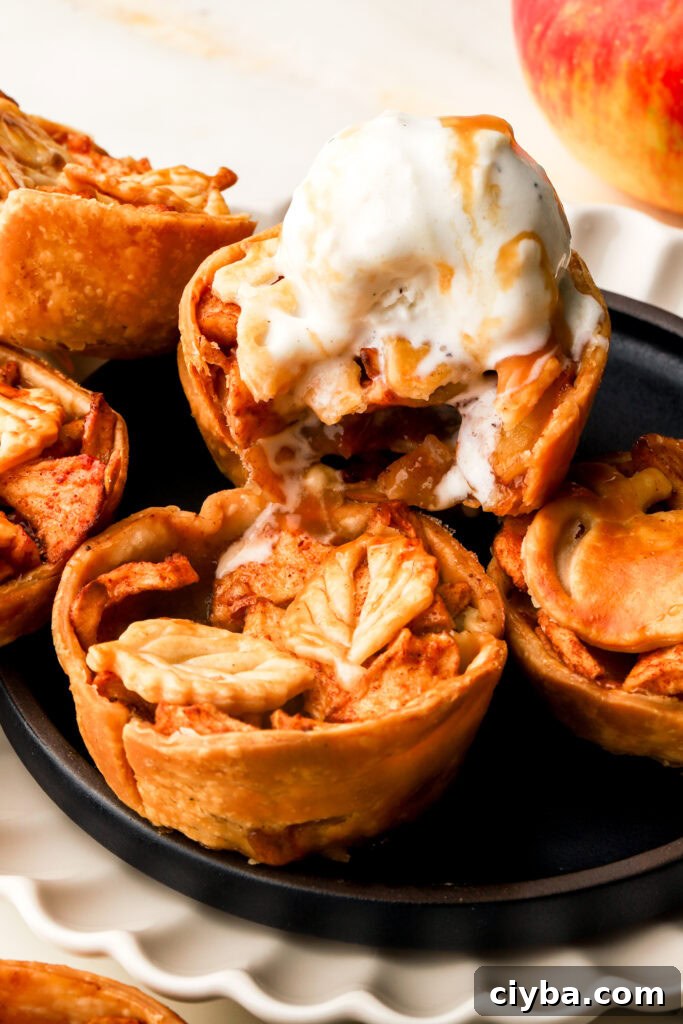 mini apple pies topped with vanilla ice cream
