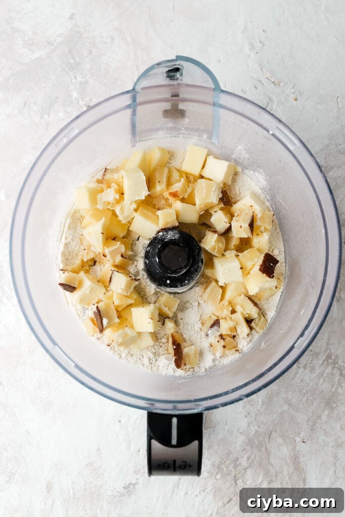 add cold cubed butter to food processor