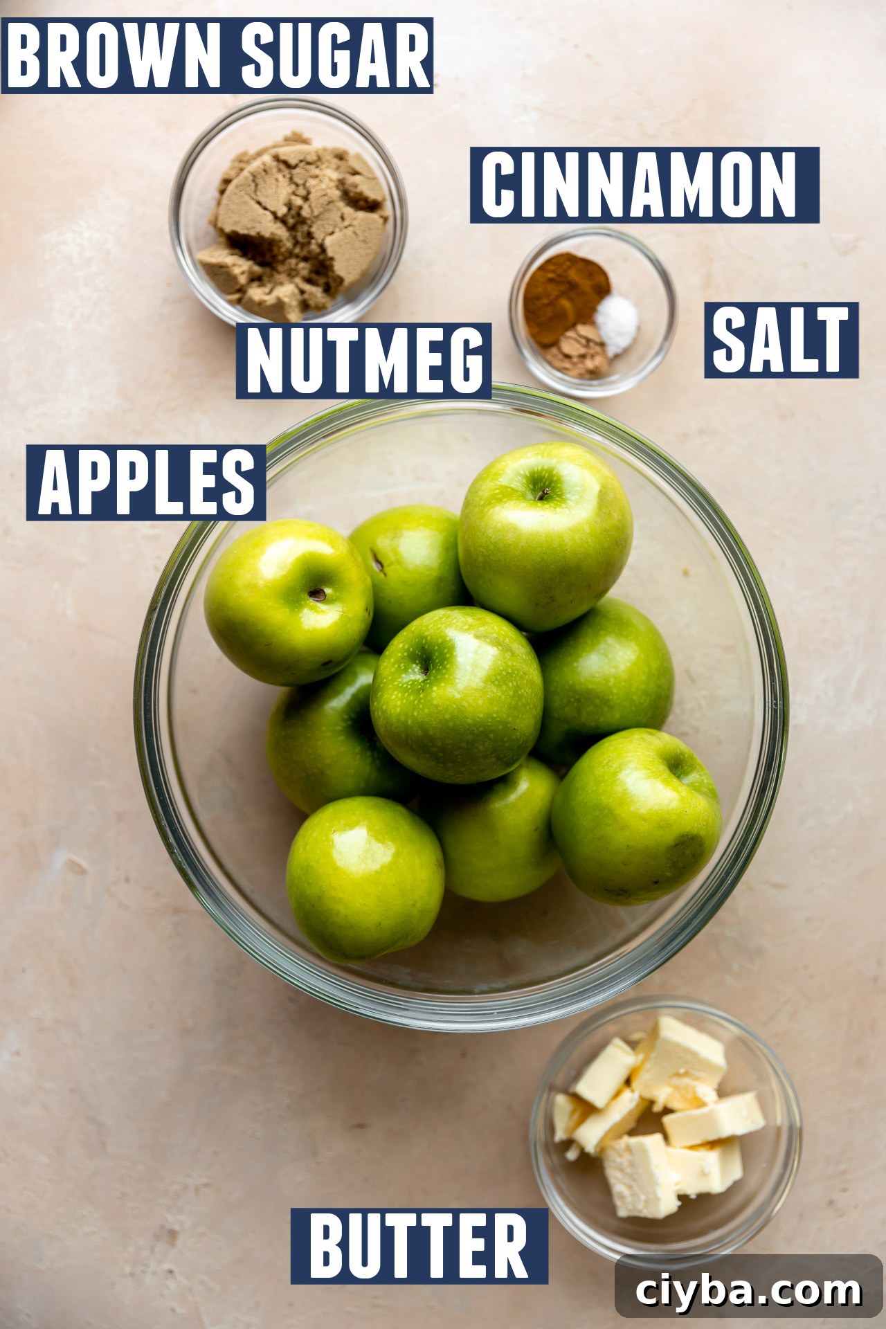 Ingredients needed to make fried apples laid out on the counter. 