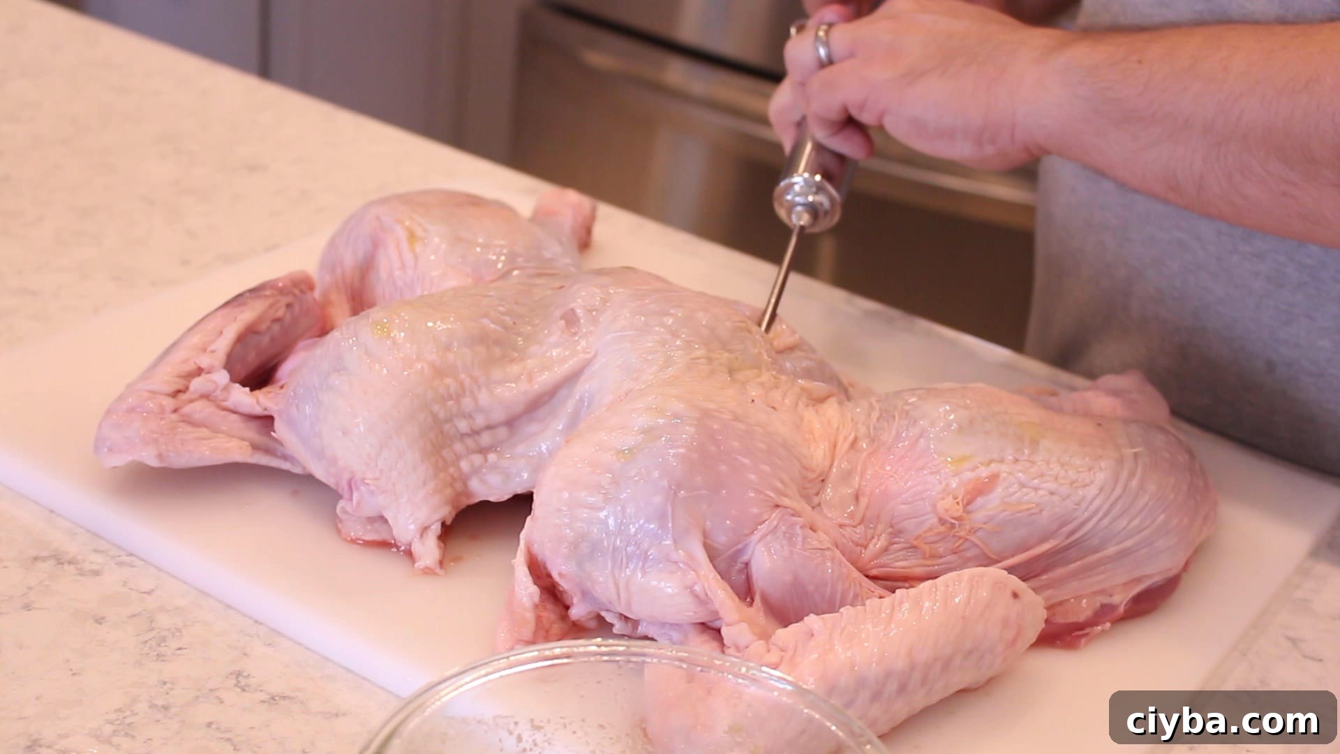 injecting a spatchcocked turkey