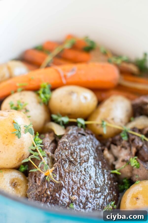 Tender Balsamic Slow-Cooker Roast 3 closeup of balsamic roast with carrots and potatoes in slow cooker
