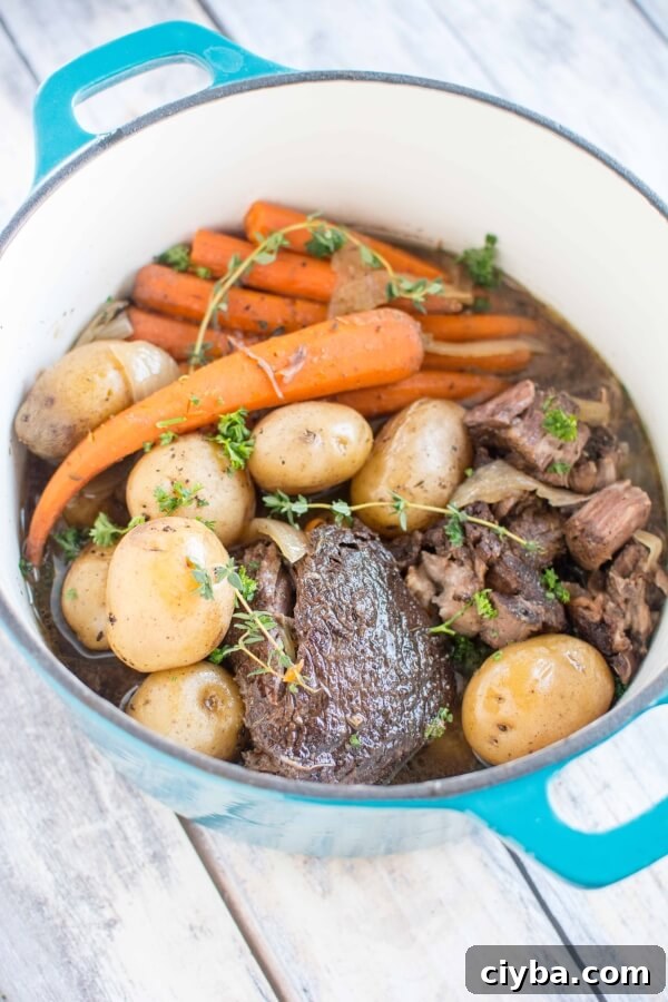 balsamic roast with carrots and potatoes in turquoise dutch oven