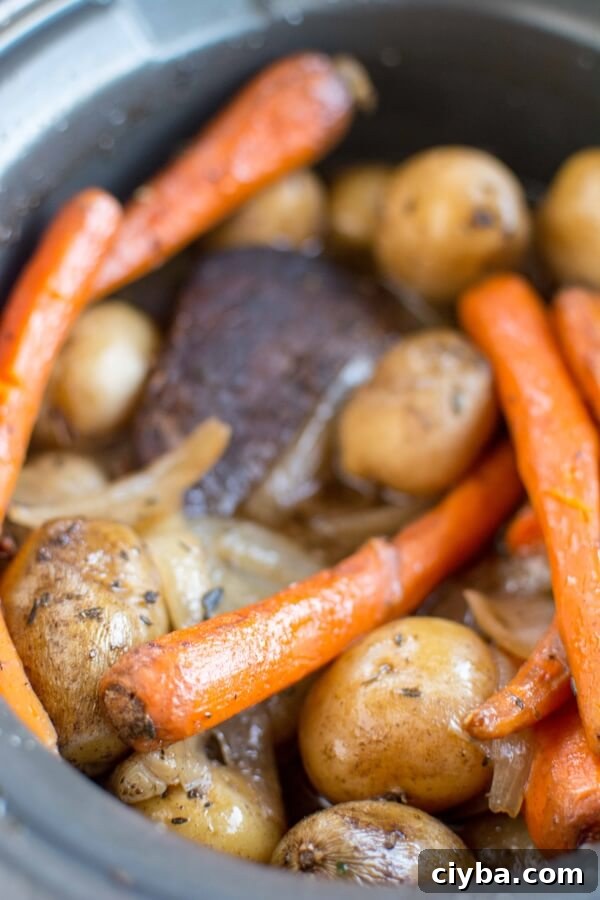 Tender Balsamic Slow-Cooker Roast 6 closeup of balsamic roast with carrots and potatoes in slow cooker